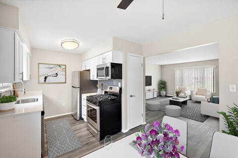 a kitchen and living room in a 555 waverly unit